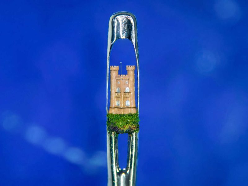 image of a tiny broadway tower in the eye of a needle